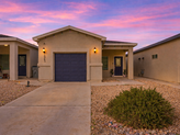 Suburban_home_at_dusk_with_lights